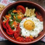 Huevos rancheros with veggies and vegan gordita with flax seeds